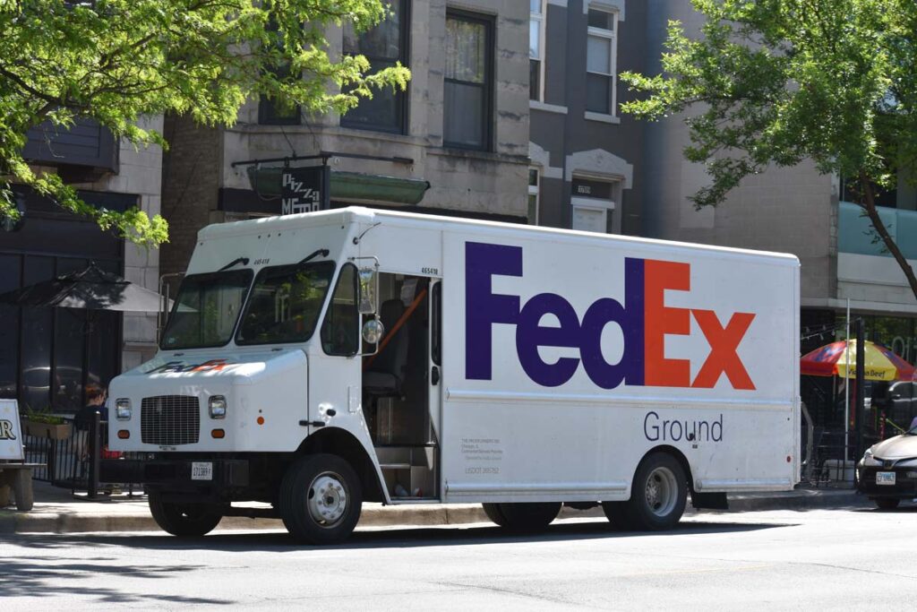 Fedex Delivery Truck parked on side of the road, representing the FedEx class action.