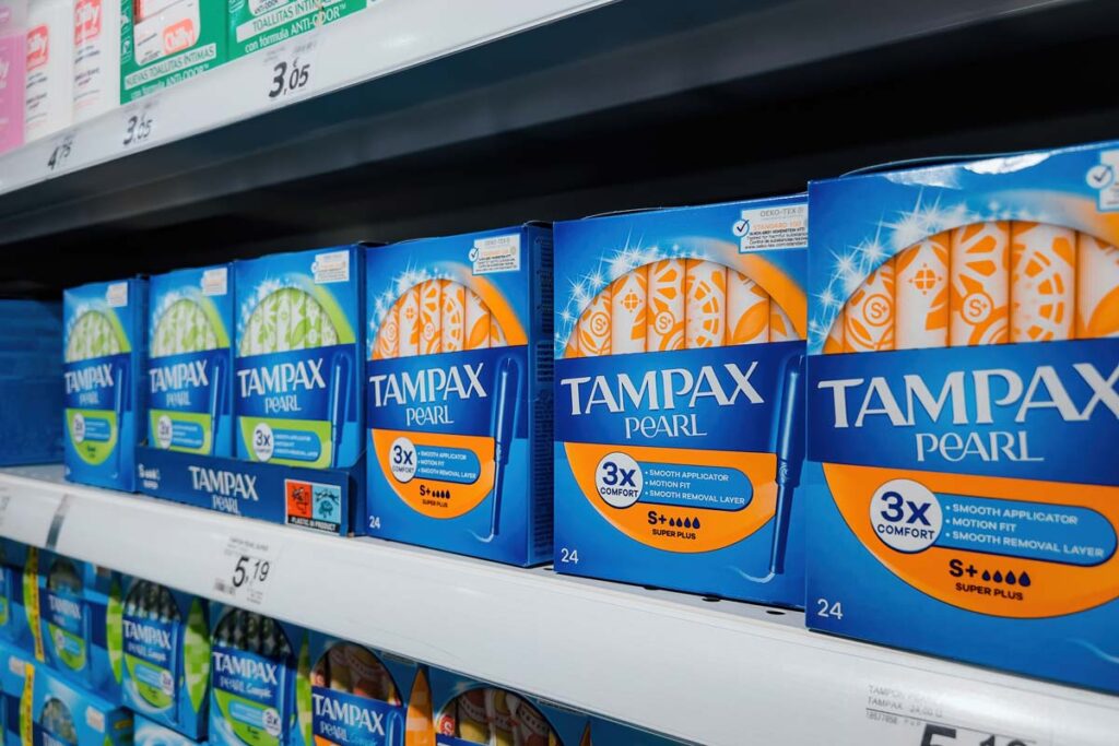 Tampax products on a supermarket shelf, representing the Tampax lead class action.