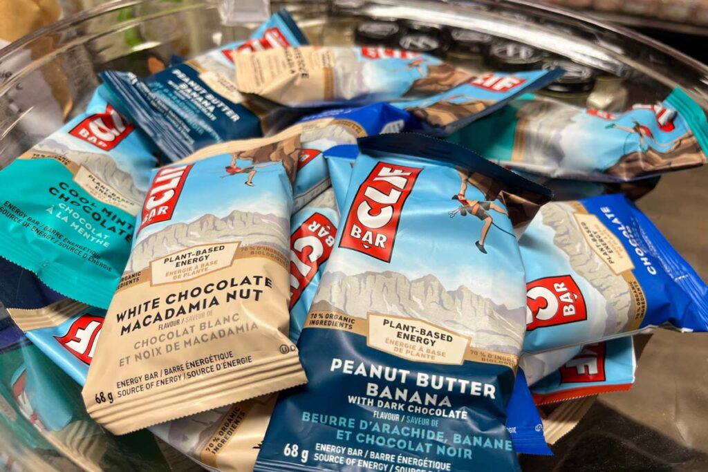 Close up of individually wrapped Clif Bars in a bowl, representing the Clif Bar settlement.