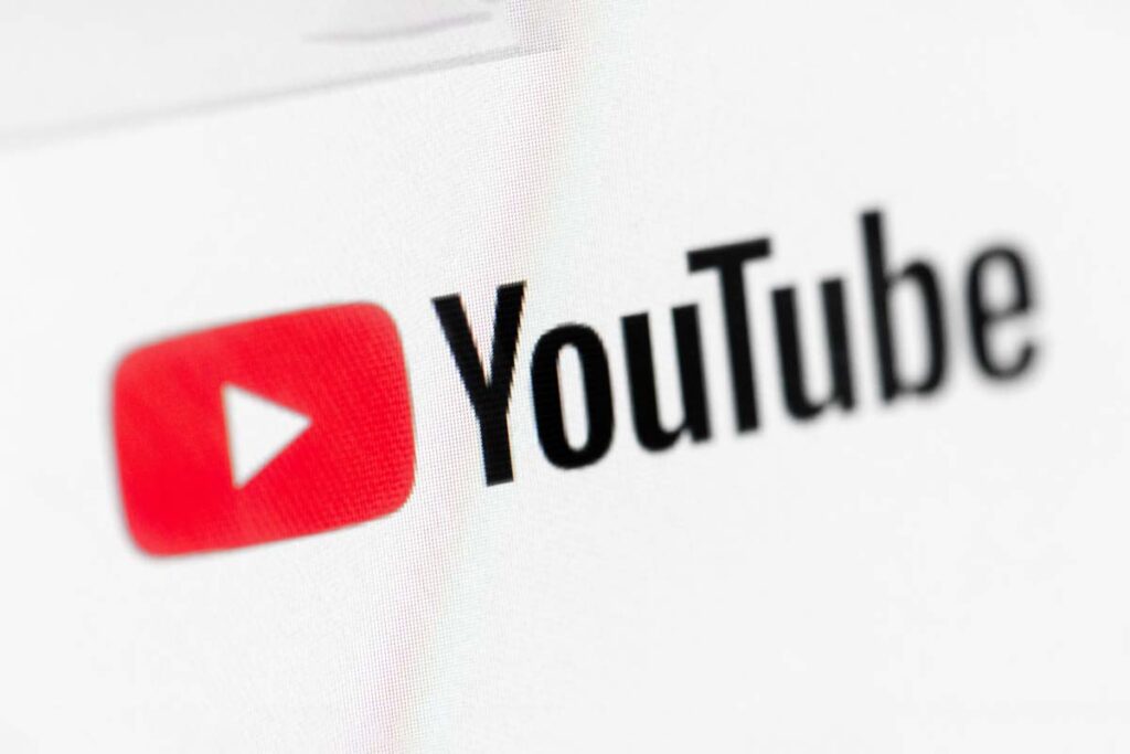 Close-up of the YouTube logo depicting the Google and OpenAI class action lawsuits.