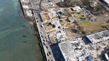 Aerial view of devastated land caused by the Lahaina wildfires, representing the Hawaii Lahaina wildfires settlement.