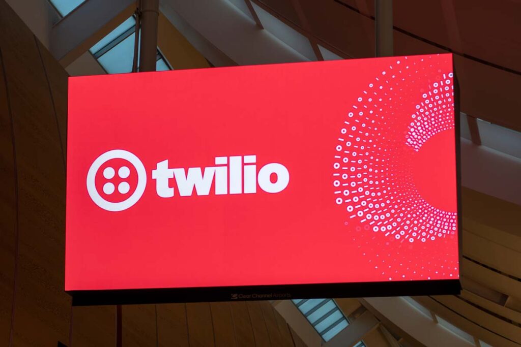 Twilio logo displayed on an advertisement screen, representing the Twilio class action.