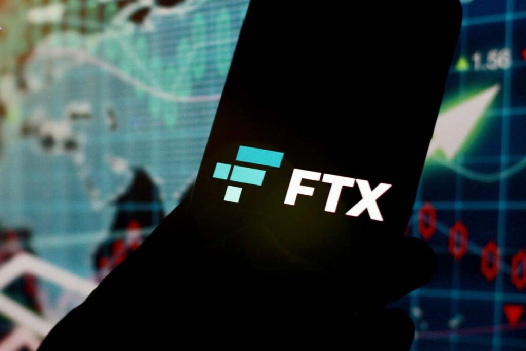 Close up of FTX logo displayed on a smartphone screen, representing the FTX and Alameda settlement.