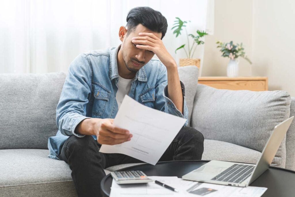 Close up of a young man reading a document, representing the CareCredit class action.