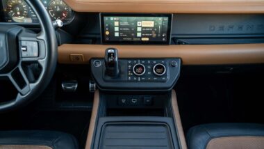 Interior of a Land Rover Defender representing the Jaguar Land Rover class action.