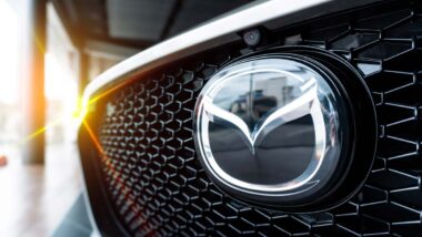 Close up of Mazda emblem on a front bumper, representing the Mazda class action.