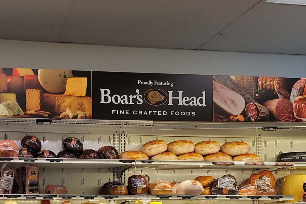 Close up of Boar's Head signage at a deli, representing the Boar's Head class action.