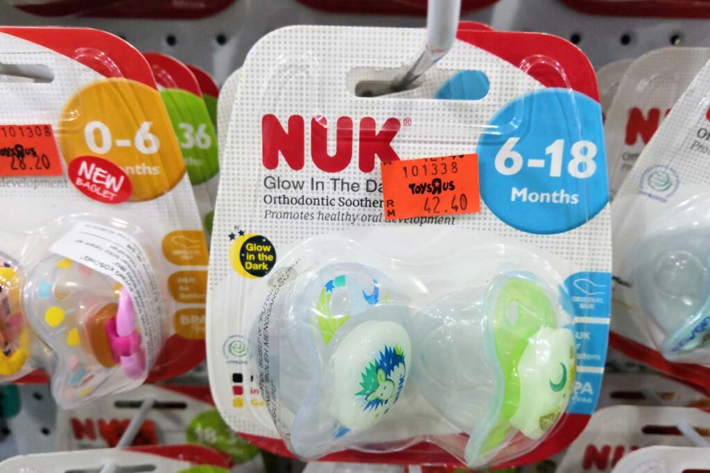 Close up of Nuk pacifier products on display in a store, representing the Nuk pacifier class action.