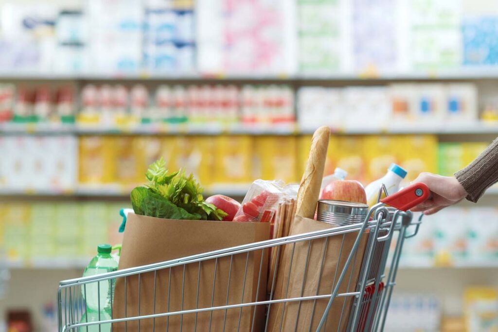 Close up of a shopping cart filled with groceries, representing top recalls for the week of Sept. 9.