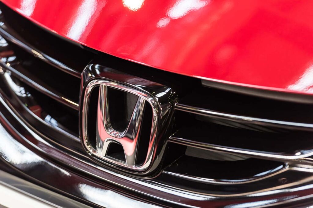 Close up of Honda emblem on a front bumper, representing the Honda class action.