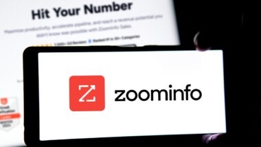 zoominfo logo on a cell phone representing the ZoomInfo class action.