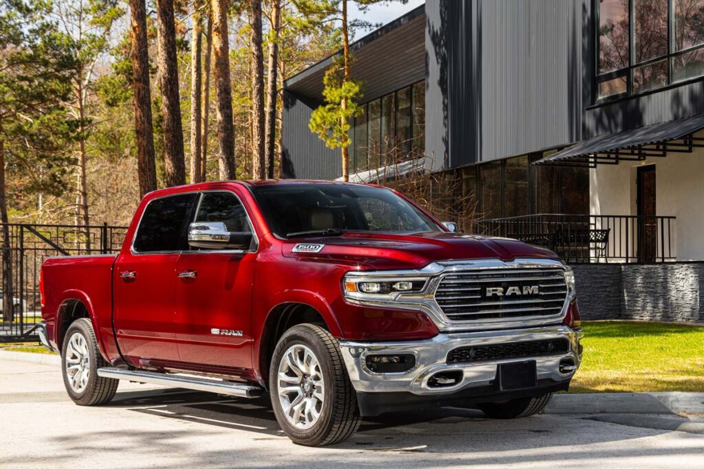 A Red Ram 1500 in a driveway, representing the Ram 1500 recall.