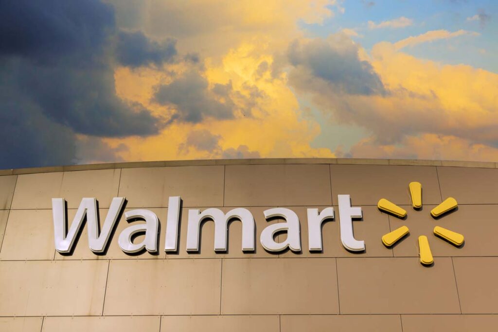 Close up of Walmart signage against a sunset sky, representing the Walmart class action.