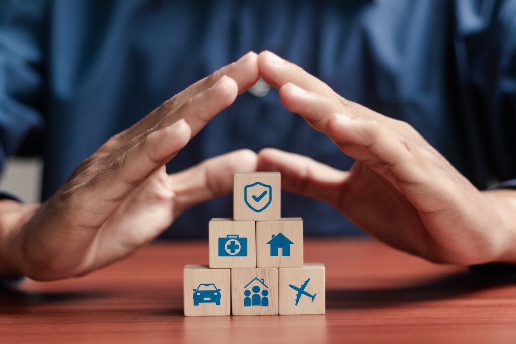 A man sheltering blocks with his hands representing Builders Mutual Insurance Co. data breach