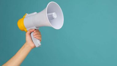 Close up of a hand holding a megaphone, representing top recalls for the week of Sept. 2.