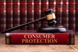 Consumer protection laws book with gavel regarding information on the Consumer Protection Act in Canada