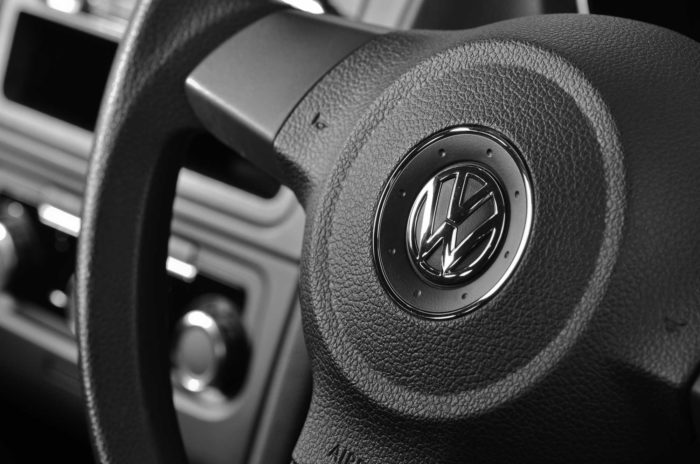 Closeup of a Volkswagen steering wheel - VW diesel scandal, vw emissions