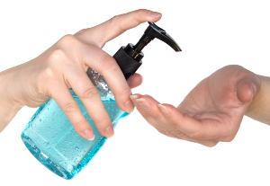 Person squirting blue hand sanitizer into their palm from bottle with black pump