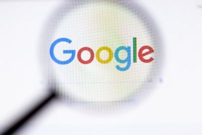 Google logo under magnifying glass - tracking cookies class action