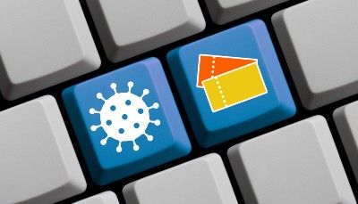 Blue coronavirus and ticket buttons on a keyboard - viagogo