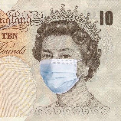 British £10 note with queen's face wearing surgical mask - coronavirus recession