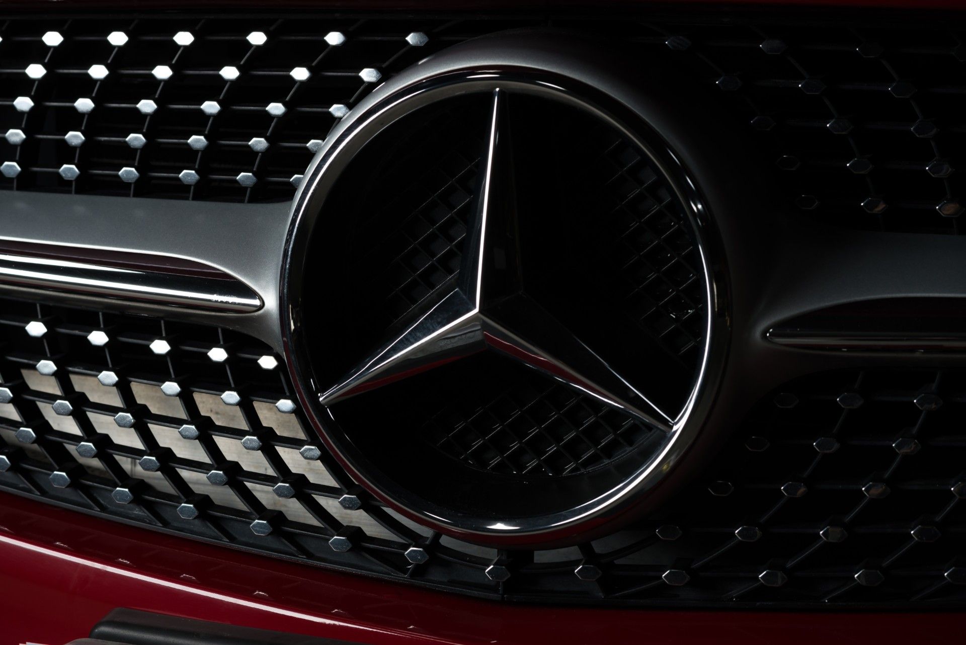 Mercedes-Benz grille on red car - emissions scandal