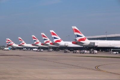 The tails of British Airways planes sit in a row at an airport - British Airways data breach