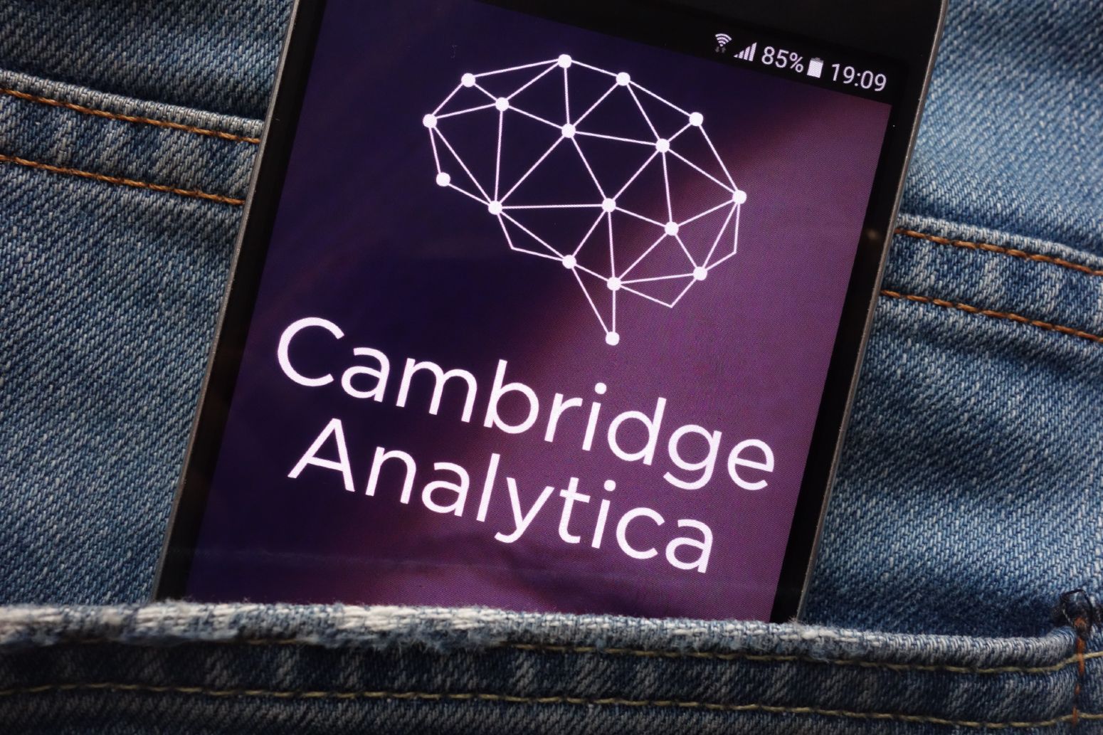 Cambridge Analytica screen on smartphone in jeans back pocket - cambridge analytica ceo