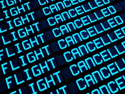 Flight board at airport shows flights cancelled - tui uk