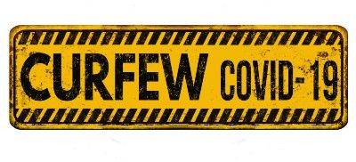 Black-and-yellow "Curfew COVID-19" sign - pub curfew