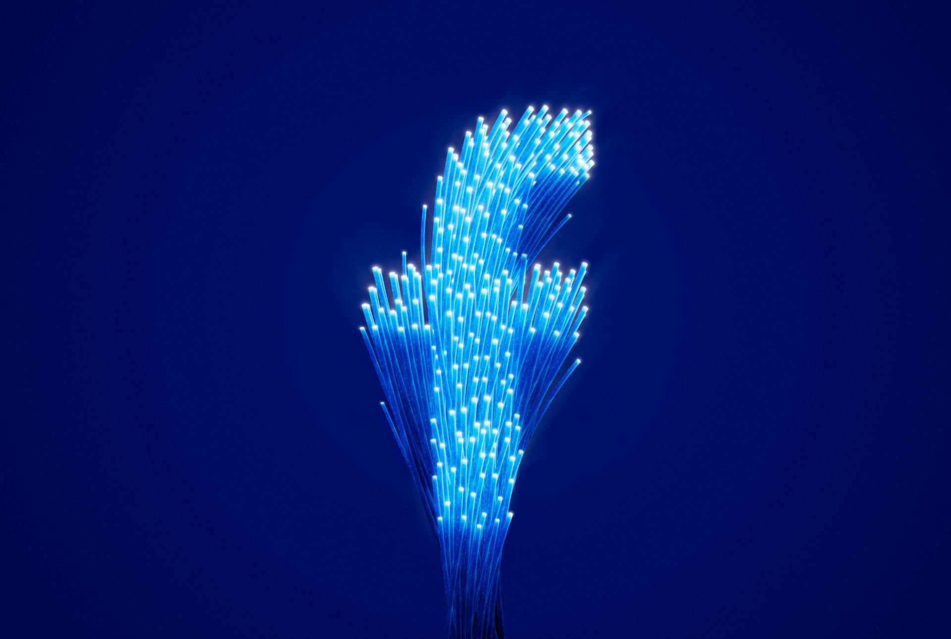 Facebook "f" logo made up of fiber optic cables - data transfers
