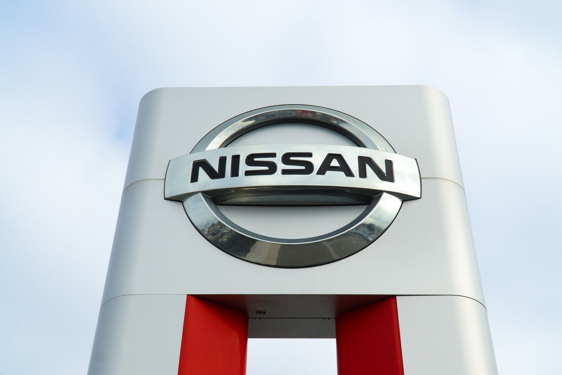 Nissan sign outside dealership - Nissan emissions