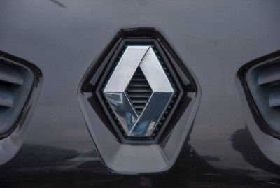 Renault hood ornament on black vehicle - nissan emissions