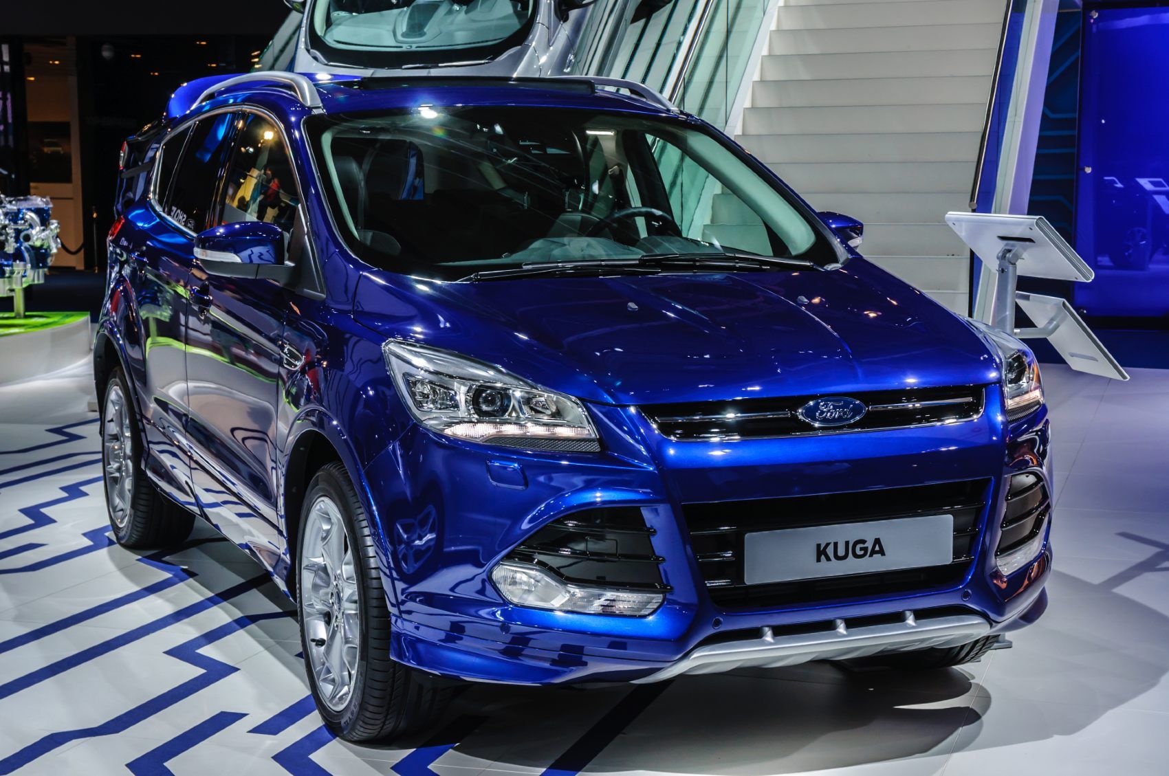 Blue Ford Kuga in an auto show showroom - kuga recall