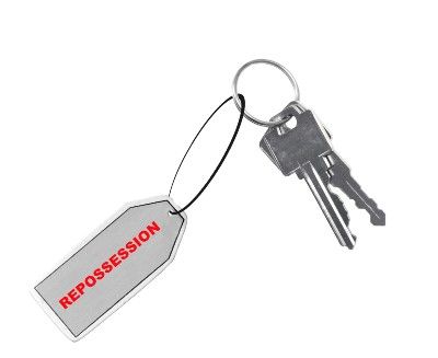 Two silver keys on a keychain with a tag that says "repossession" in red - mortgage holiday