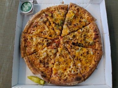 A Papa John's pizza, pepperoncini and garlic sauce in a pizza box - eat out to help out fraud