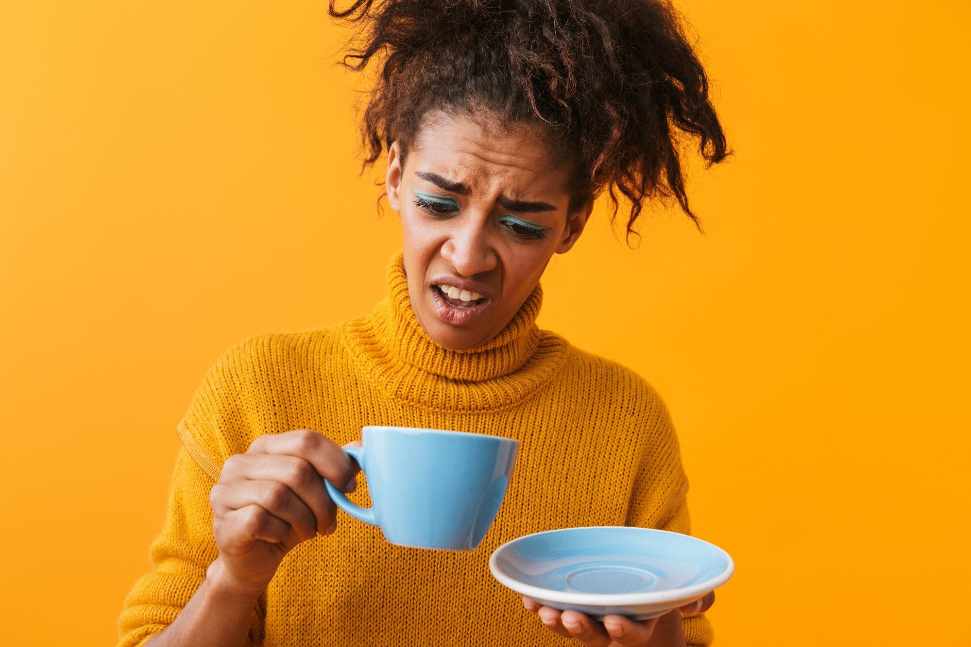 woman disgusted with coffee regarding Nestle recall of espresso 