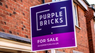 real-estate agents purple bricks sign showing the availability of a property for sale.