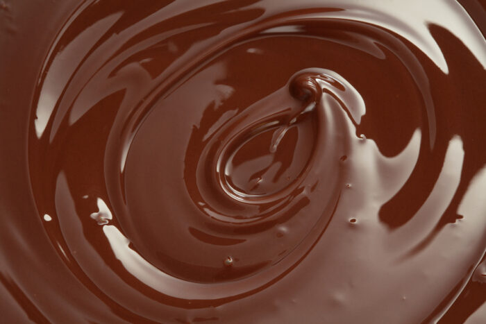 Melted chocolate swirl background.