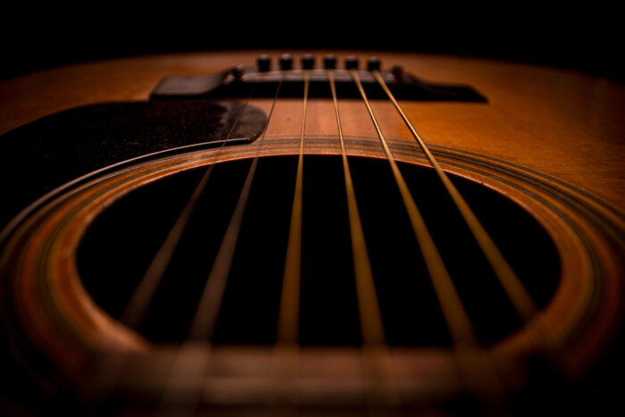 Closeup image of an acoustic guitar.