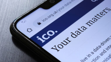 The Information Commissioner's Office ICO website seen on the smartphone corner.