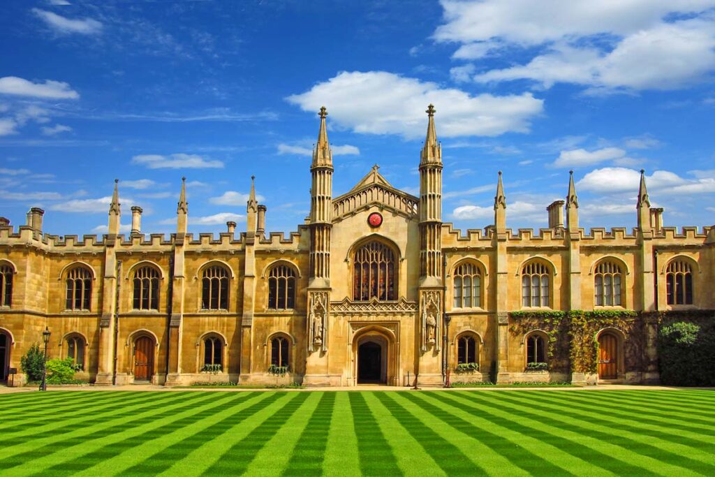 University in Cambridge with a beautiful lawn under a blue sky on a sunny day in summer.