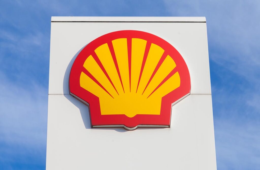 Close up of Shell signage against a bright blue sky.