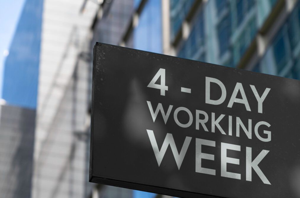 A sign on a building that reads "4-Day Working Week"