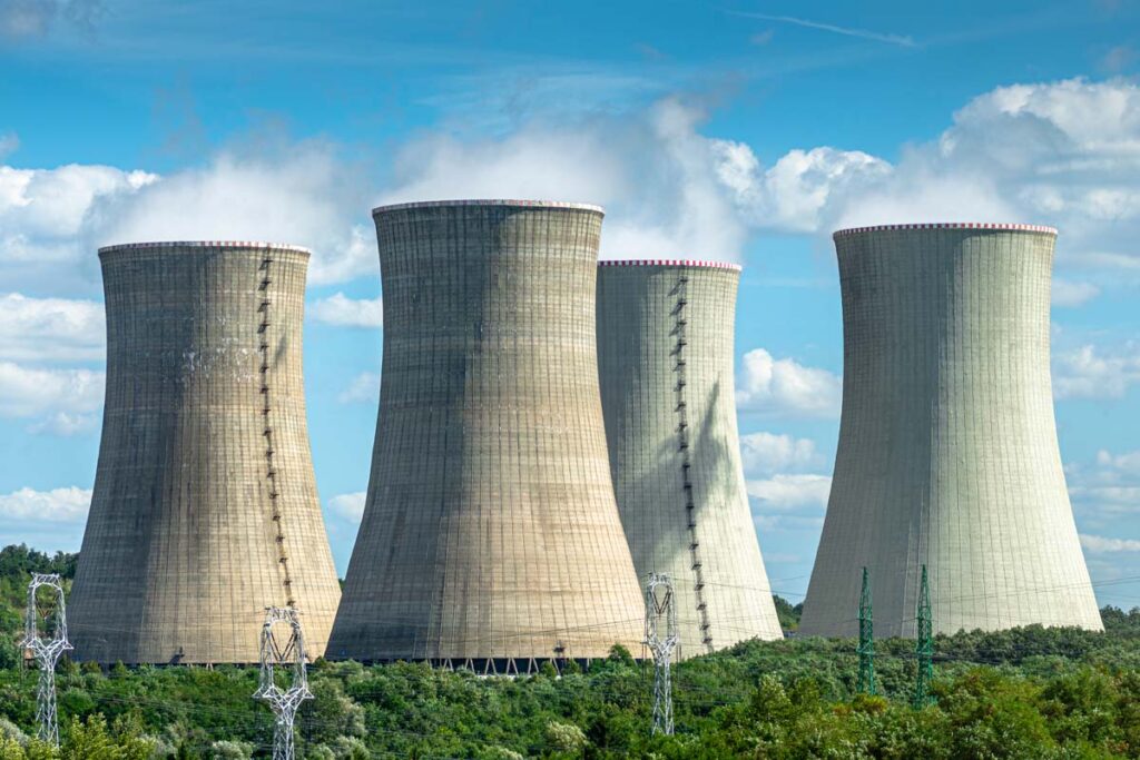 Cooling towers at a nuclear power plant, representing the Westinghouse antitrust investigation.