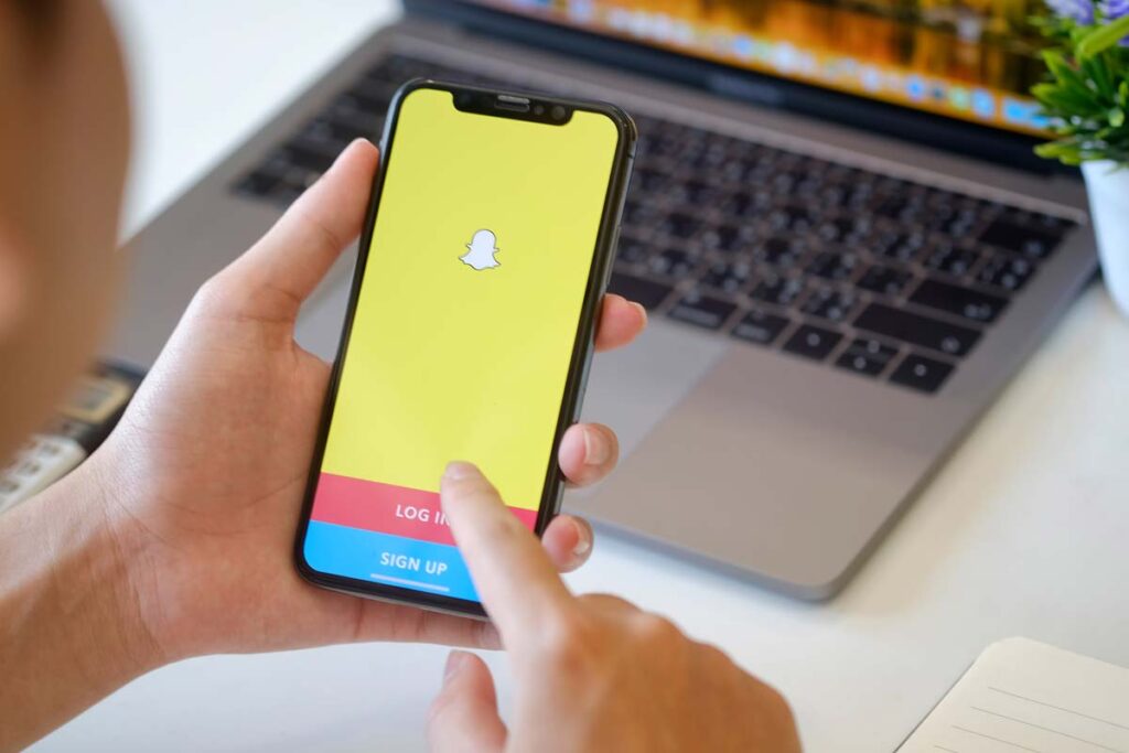 Close up of Snapchat login page displayed on a smartphone screen, representing the Snapchat AI investigation.