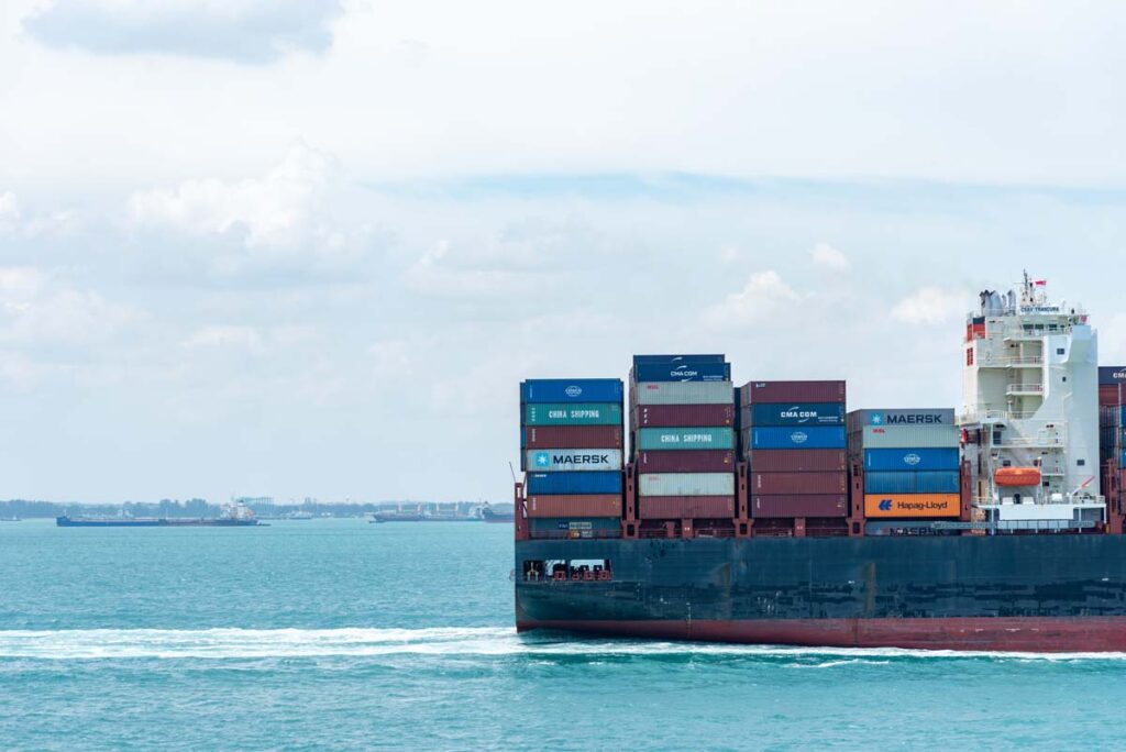 CSAV container cargo ship at sea, representing the motorists class action settlement.