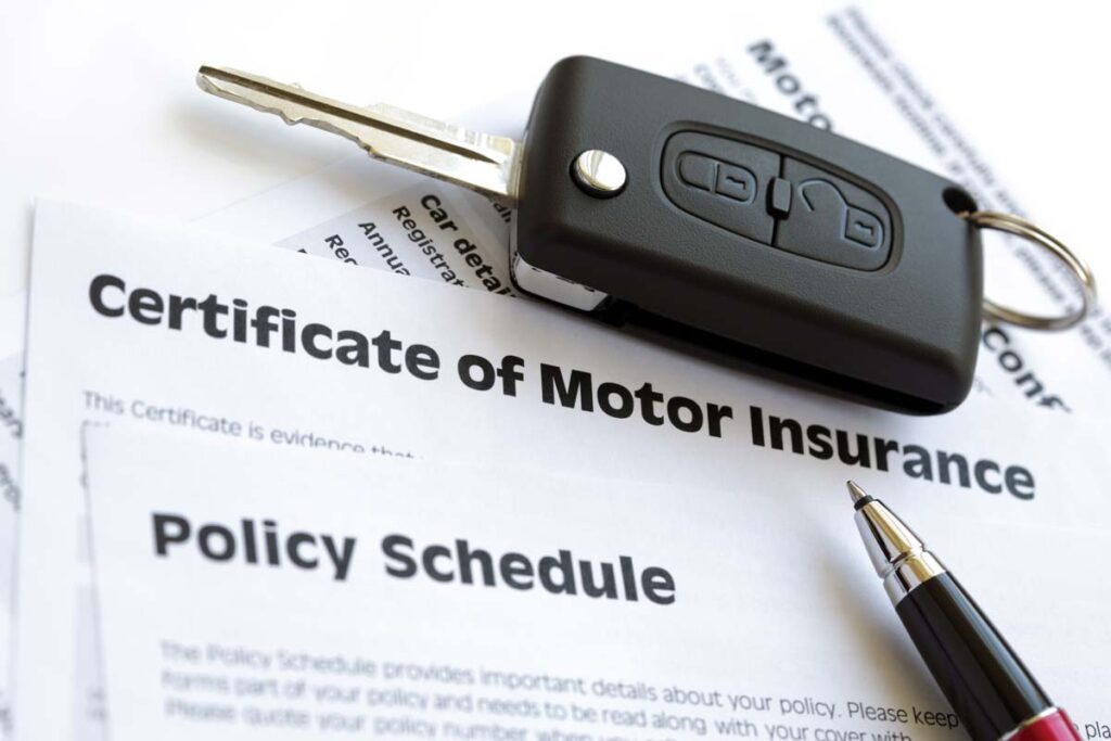 Car keys on top of motor insurance paperwork, representing the motor insurer losses.