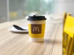 Mcdonald's coffee cup on table in restaurant.