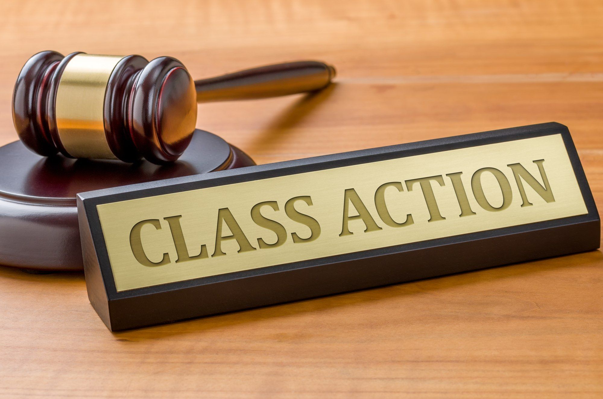 Class action label and gavel regarding information on how many people it takes to file a class action lawsuit